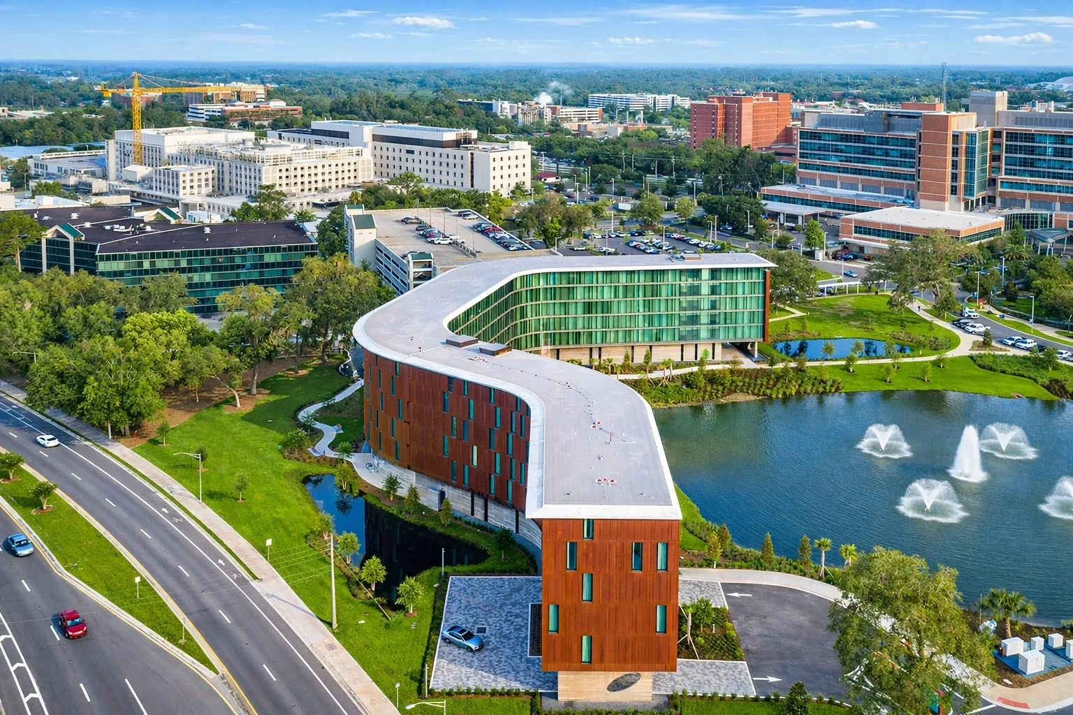 Modern building with lake and fountains view.